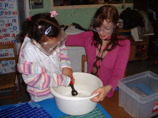 A schoolgirl helps to make the mosaic