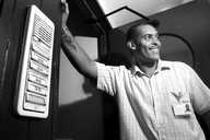 A worker stands beside Woodside