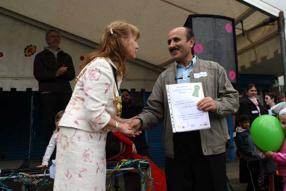 Jackie Drayton congratulates an adult learner