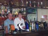 Martin and Gina behind The Grapes' bar