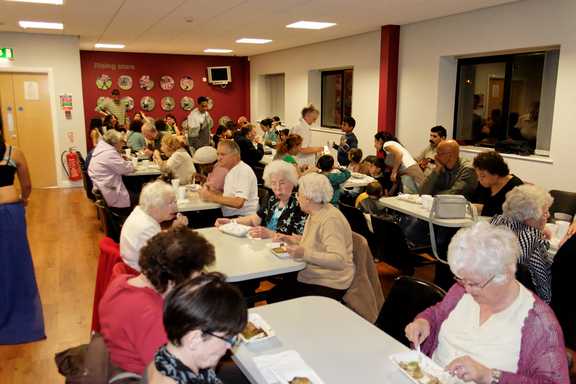 The audience tuck into pie & peas