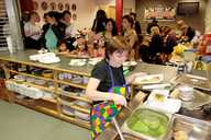 The hungry crowd line up for pies