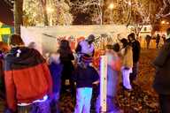 Artist Shaun Tummings giving a tutorial to a crowd of children