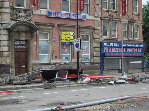 Flood damage to safety barriers and building materials.
