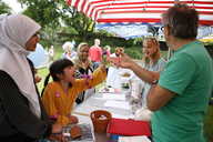 Chatting by the stall.