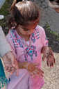 Young girl with henna hands.