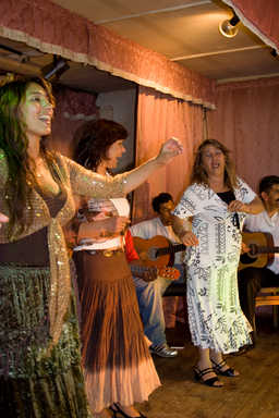 Dancing to Roma music.