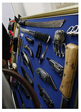 A display of knives and other combat tools