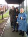Residents wait for bus