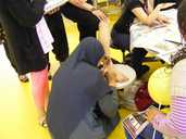 A girl gets a henna tattoo