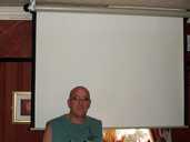 Kevin Greaves of the Royal Oak, in front of his big screen.