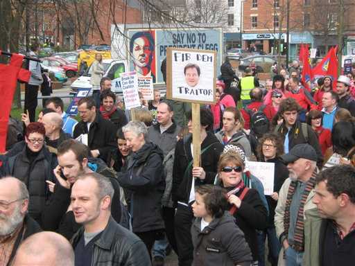 Protestors with banners at Lib Dem Party demo