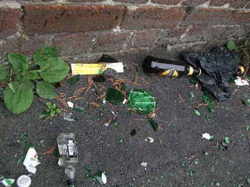 Broken glass bottles everywhere.