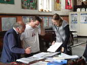 Visitors looking at records