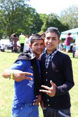 Two young visitors posing for camera