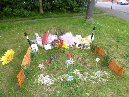 Friends and family placed tributes and messages at the murder scene