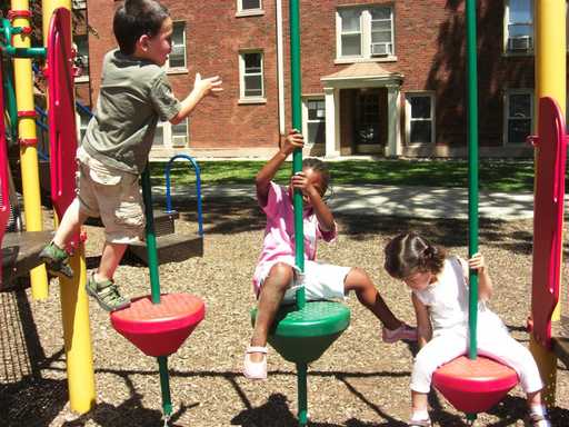 Children climbing on gates