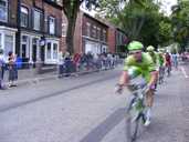 The riders pass in a blur