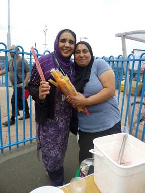 Happy cooks on a food stall