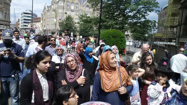 Demonstrators listened to speeches outside the Town Hall