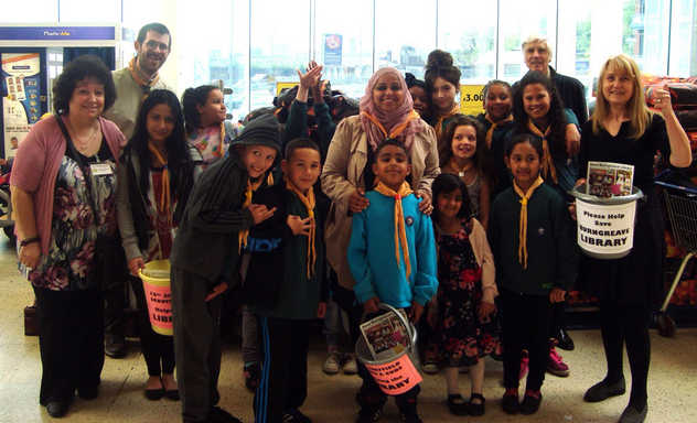 Scouts and TARA bag packers for library funds